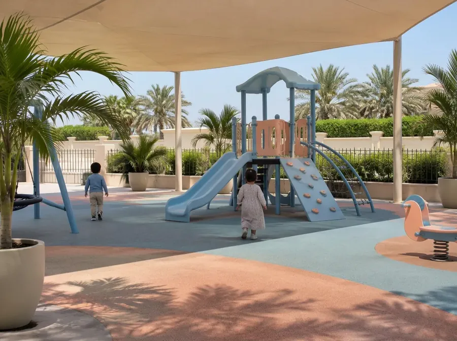 Children seen from behind playing in a shaded outdoor playground